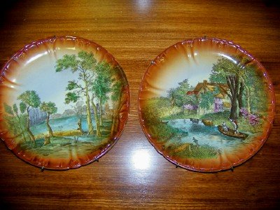 Pair of scenic hand painted plates