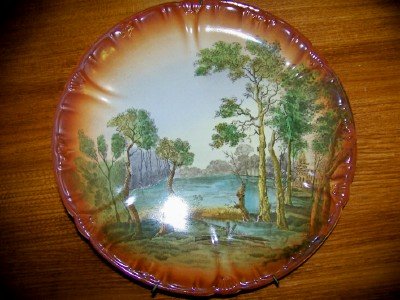 Pair of scenic hand painted plates