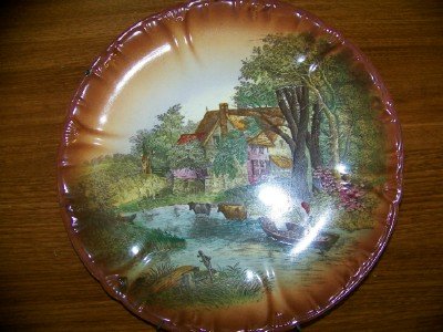 Pair of scenic hand painted plates
