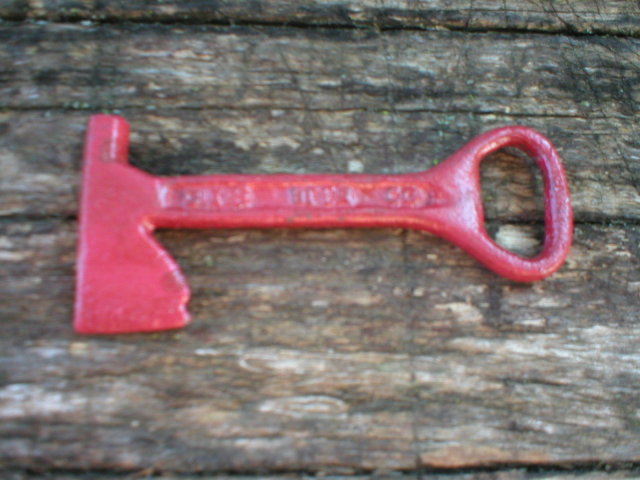 RED AXE BOTTLE OPENER MARKED DIXIE BEER CAST IRON