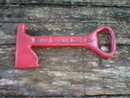 RED AXE BOTTLE OPENER MARKED DIXIE BEER CAST IRON