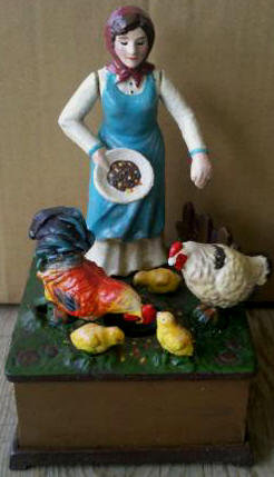 LADY FEEDING CHICKENS OLD MACDONALD FARM MUSICAL WIND UP BANK