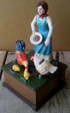 LADY FEEDING CHICKENS OLD MACDONALD FARM MUSICAL WIND UP BANK