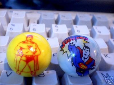TWO SUPERMAN GLASS LOGO MARBLES