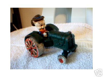 CAST IRON PORKY PIG TRACTOR