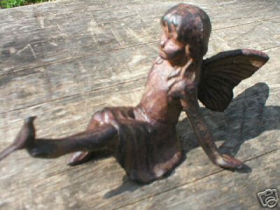 CAST IRON FAIRY HOLDING BIRD