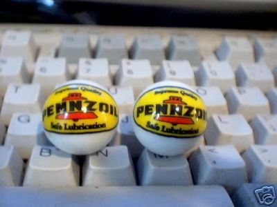 TWO PENNZOIL MARBLES