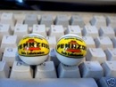 TWO PENNZOIL MARBLES