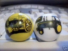TWO JOHN DEERE MARBLES