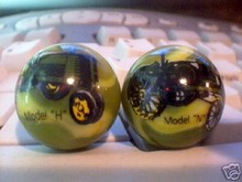 TWO JOHN DEERE MARBLES
