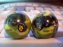 TWO JOHN DEERE MARBLES