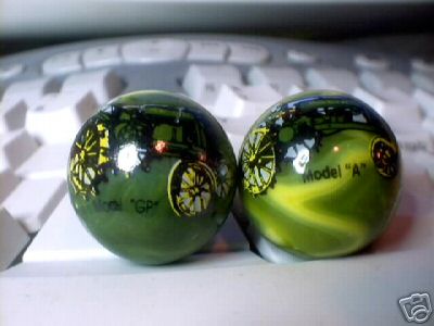 TWO JOHN DEERE MARBLES