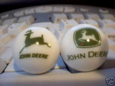 TWO JOHN DEERE MARBLES