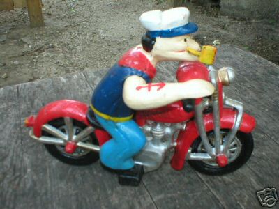 POPEYE WITH PIPE ON MOTORCYCLE CAST IRON