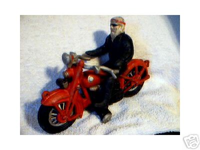 HIPPIE ON A RED MOTORCYCLE CAST IRON COLLECTIBLE