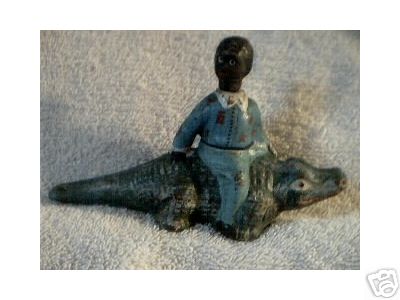 BOY ON ALLIGATOR CAST IRON