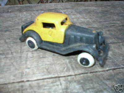 SMALL CAST IRON YELLOW BLACK TOY CAR