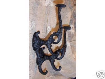 A PAIR OF CAST IRON VICTORIAN STYLE COAT/HAT HOOKS NR