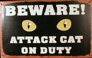 ATTACK CAT ON DUTY TIN METAL SIGN