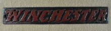 VINTAGE CAST IRON WINCHESTER SIGN GUN AMMO HUNTING MERCHANDISE SIGN