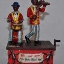 SPIC AND SPAM WIND UP MUSICAL MECHANICAL BANK CAST IRON