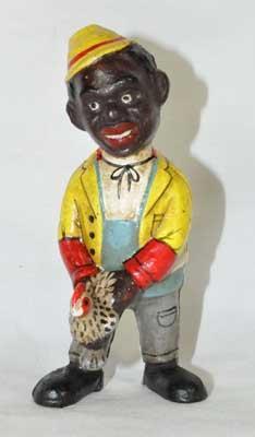 BLACK MAN HOLDING CHICKEN CAST IRON