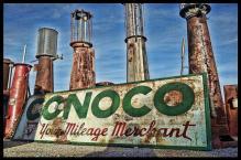 CONOCO YOUR MILEAGE MERCHANT old visible gas pumps HEAVY METAL sign