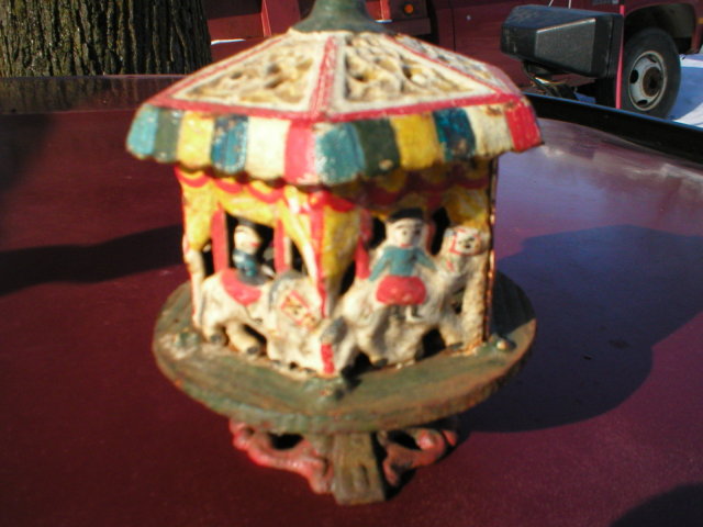 CAST IRON TOY MERRY-GO-ROUND