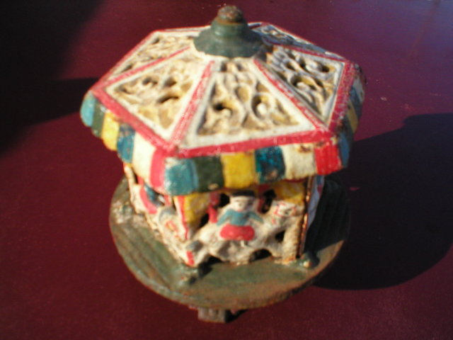 CAST IRON TOY MERRY-GO-ROUND