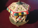 CAST IRON TOY MERRY-GO-ROUND