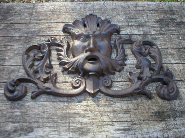 NORTH WIND WALL DESIGN CAST IRON