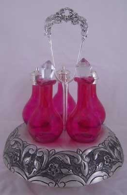 CRUET SET 5 CRANBERRY GLASS BOTTLES