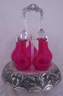 CRUET SET 5 CRANBERRY GLASS BOTTLES