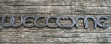 HORSESHOE WELCOME SIGN CAST IRON
