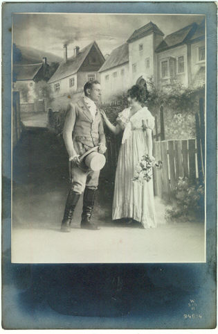 Photo postcard of Couple Dressed Up on Set
