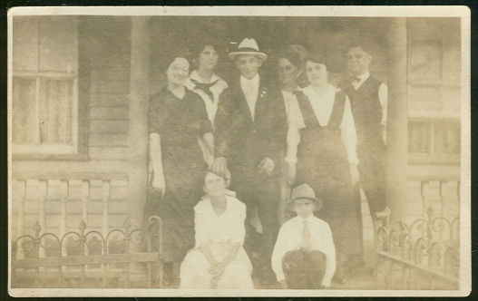 Real Photo Postcard of Large Family Standing on Porch