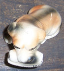 Vintage Pottery Dog Figurine with Newspaper in Mouth