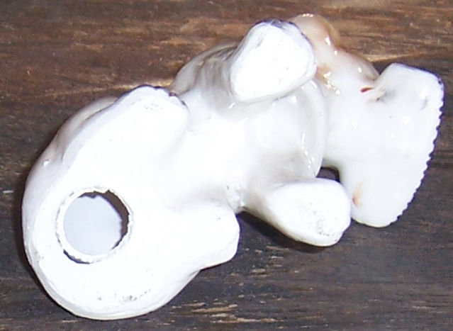 Vintage Pottery Dog Figurine with Newspaper in Mouth