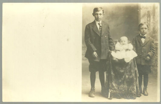 Real Photo Postcard of Two Boys Standing with Baby
