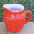 Vintage Orange Fired on Glass Creamer