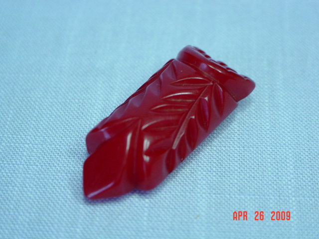 Carved Red Bakelite Dress Clip