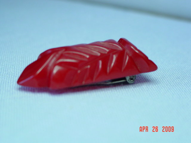 Carved Red Bakelite Dress Clip