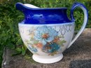 Early American Dinnerware Ceramic Cobalt-trimmed Jug with Floral Decal