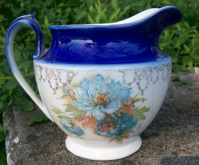 Early American Dinnerware Ceramic Cobalt-trimmed Jug with Floral Decal