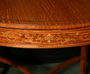A Small Satinwood Center Table