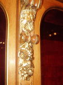 A Museum Quality Oak Display Cabinet with fine quality Giltwood Carving to the Crown and Body of the cabinet.