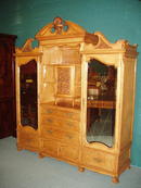 An excellent quality English 19th century Armoire in Satinwood with finely detailed carving.