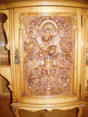 An excellent quality English 19th century Armoire in Satinwood with finely detailed carving.