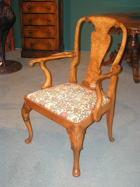 A fine and rare set of 12 English Burr Walnut Queen Anne Dining Chairs .The set comprises of 10 Side Chairs and 2 armchairs
