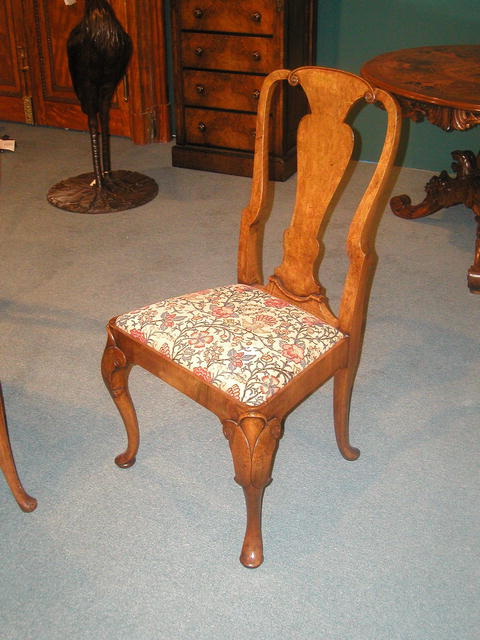 A fine and rare set of 12 English Burr Walnut Queen Anne Dining Chairs .The set comprises of 10 Side Chairs and 2 armchairs